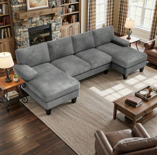 U-shaped sofa with corduroy upholstery.
